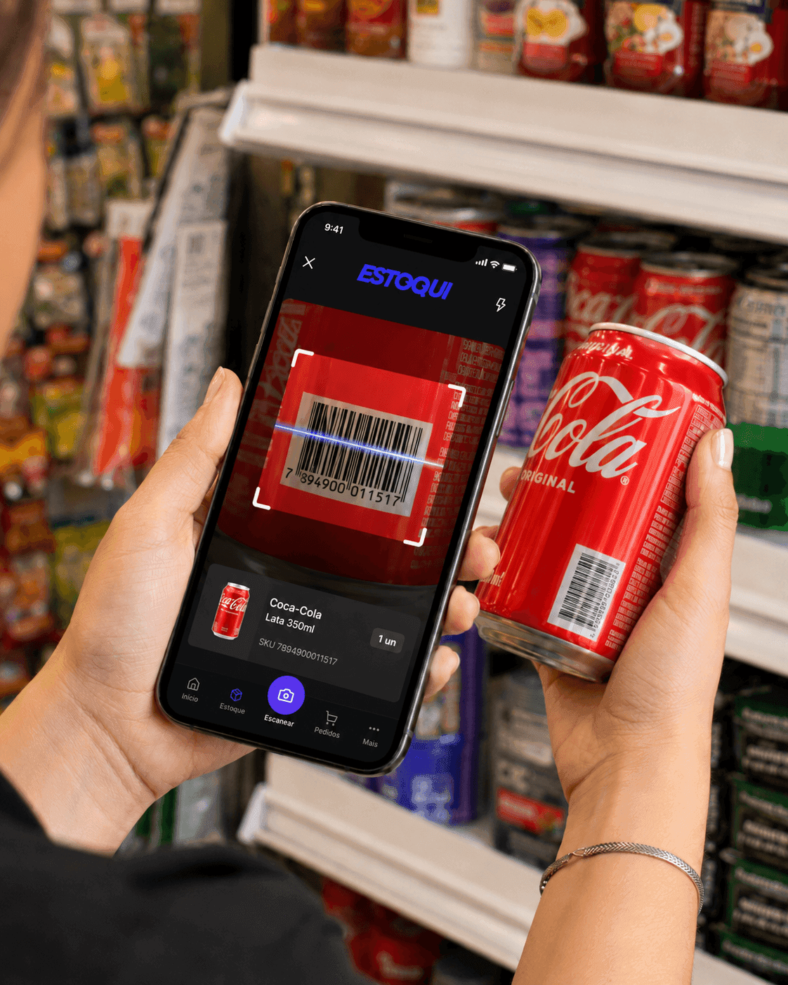 Person scanning Coca-Cola barcode with Estoqui app in real grocery store showing live barcode detection